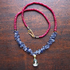 faceted rubies with iolite and green amethyst Necklace
